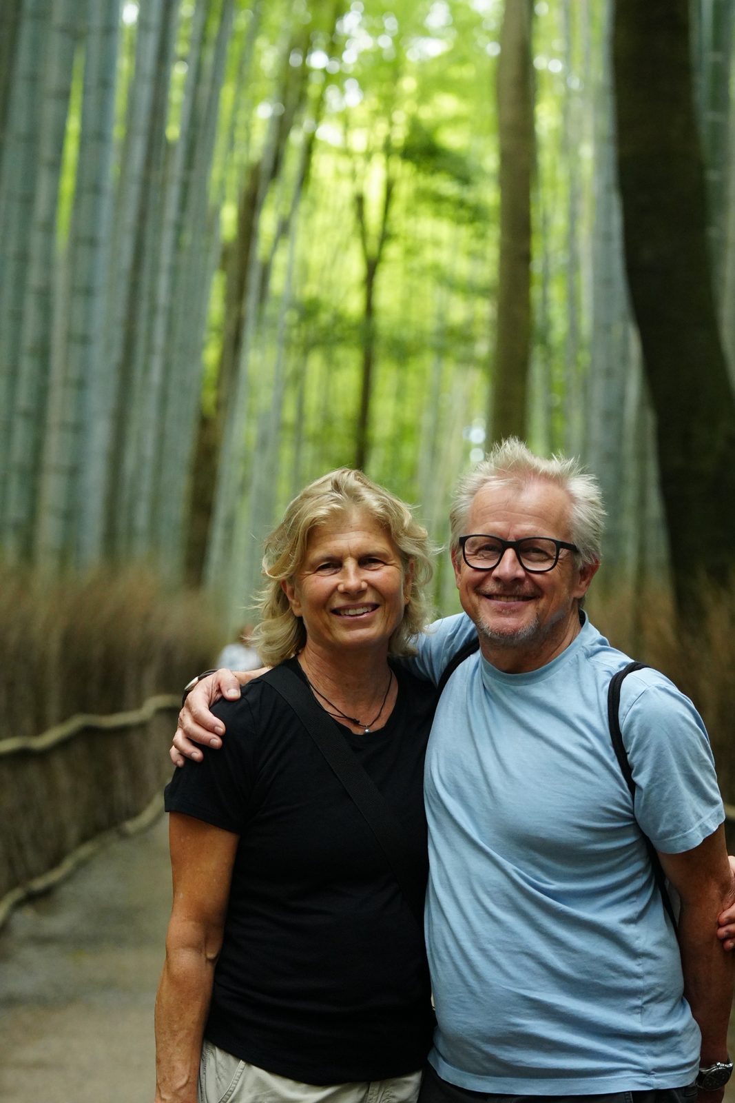 Guests on a bamboo-lined path