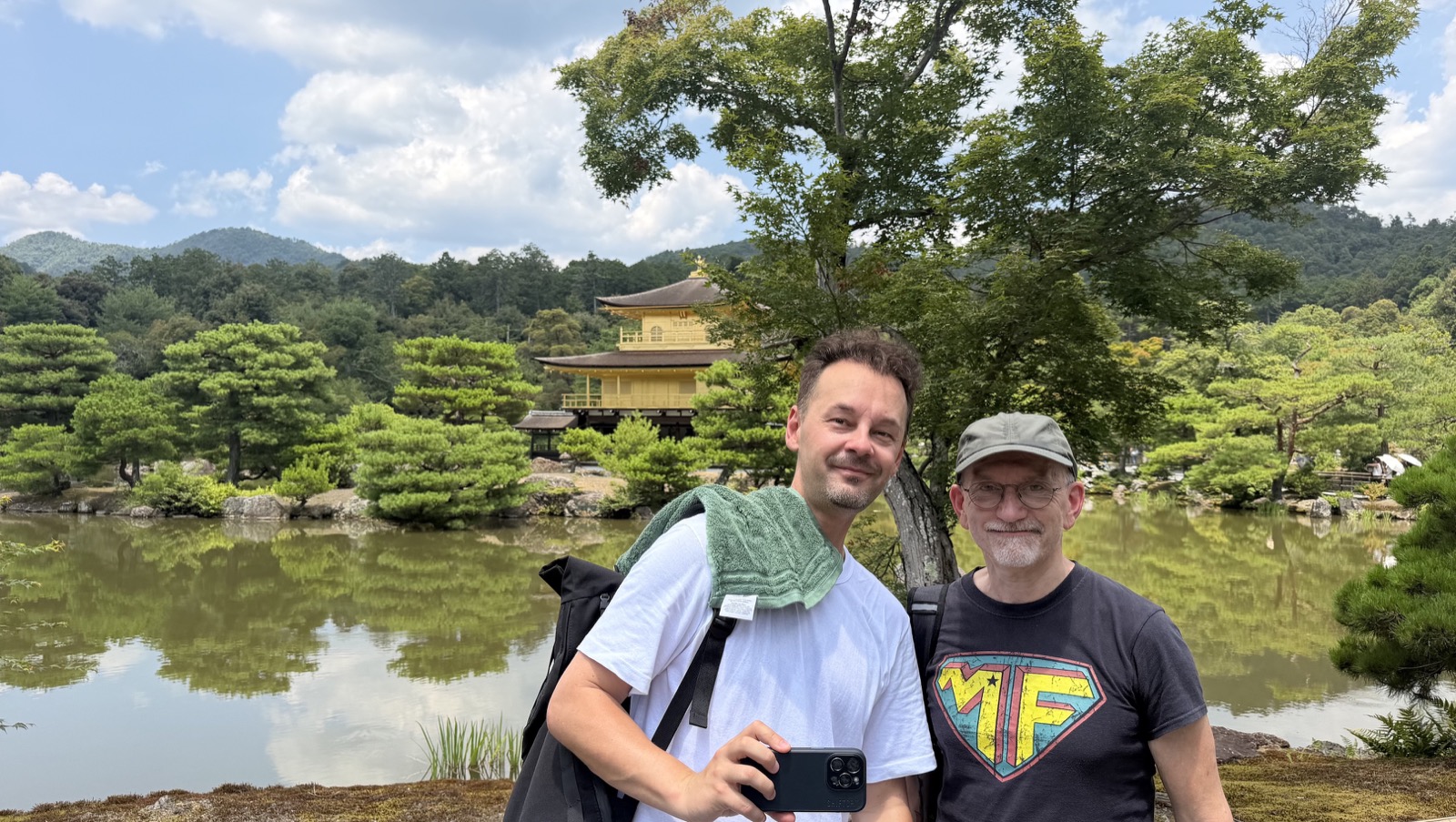 Two guests in front of the Golden Pavilion in Kyoto